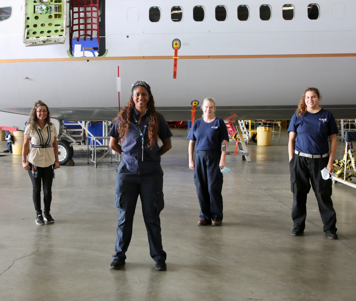 Mechanics in front of an airplane