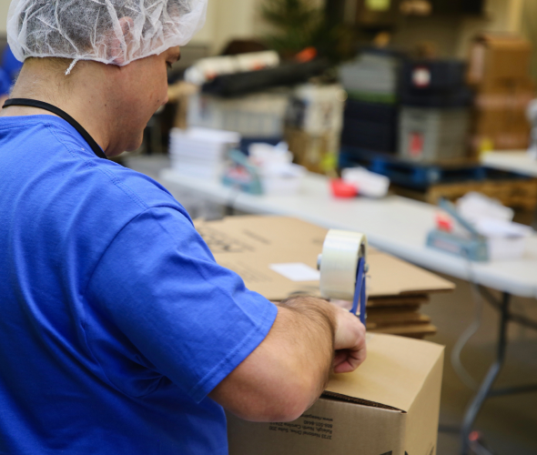 AAR employee holding a box