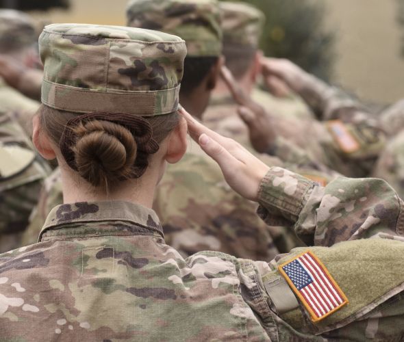 Female veteran saluting