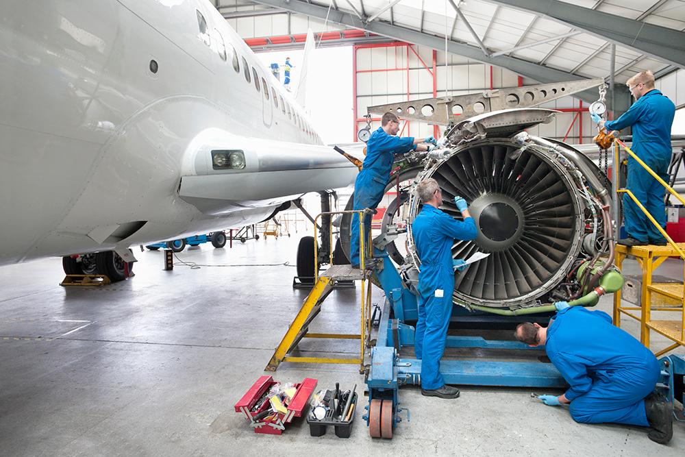 mechanics working on engine