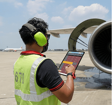Employee monitoring an airplane