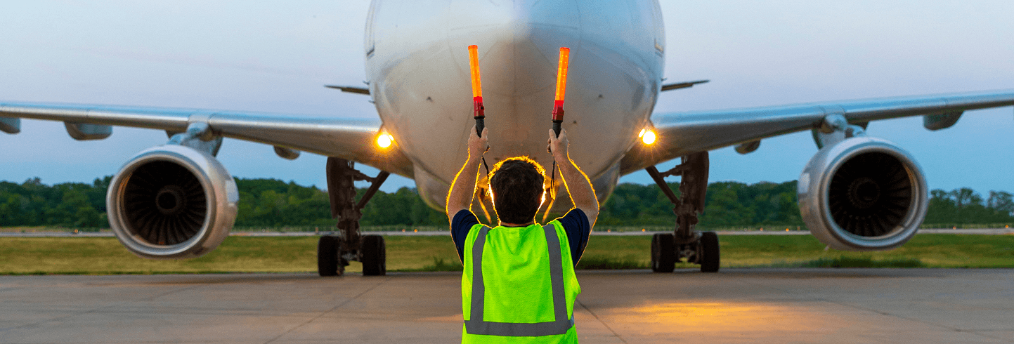 Air traffic controller directing a plane