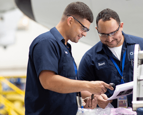 Two employees working together