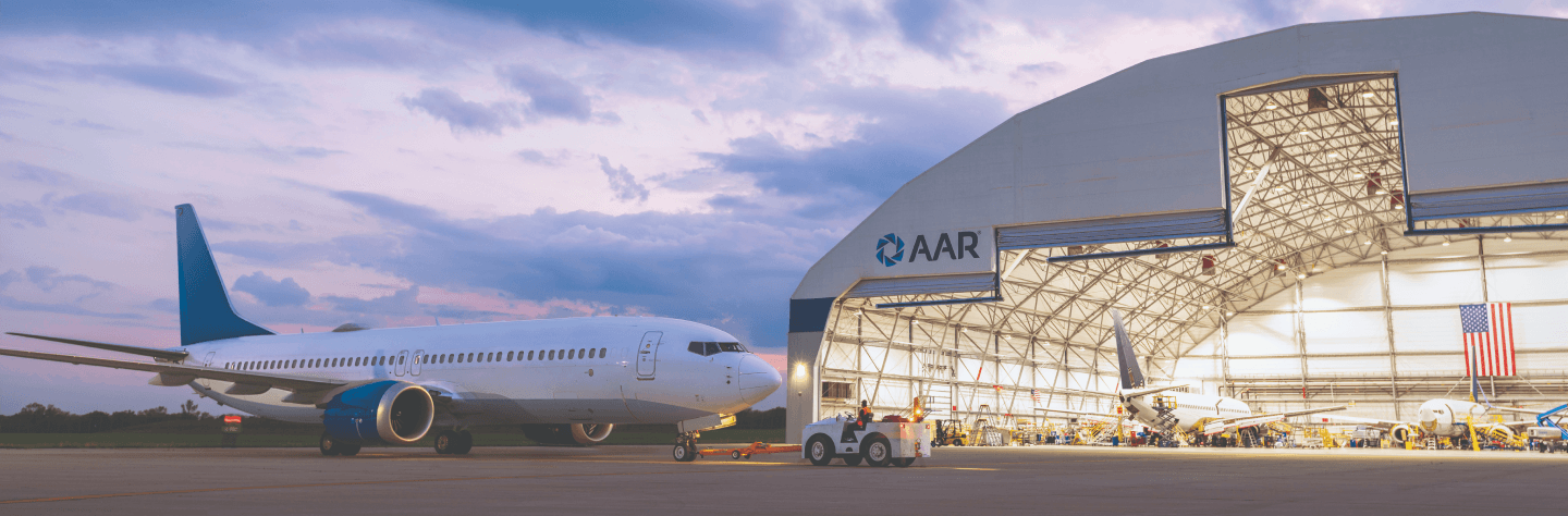 Airplane in front of an AAR hangar
