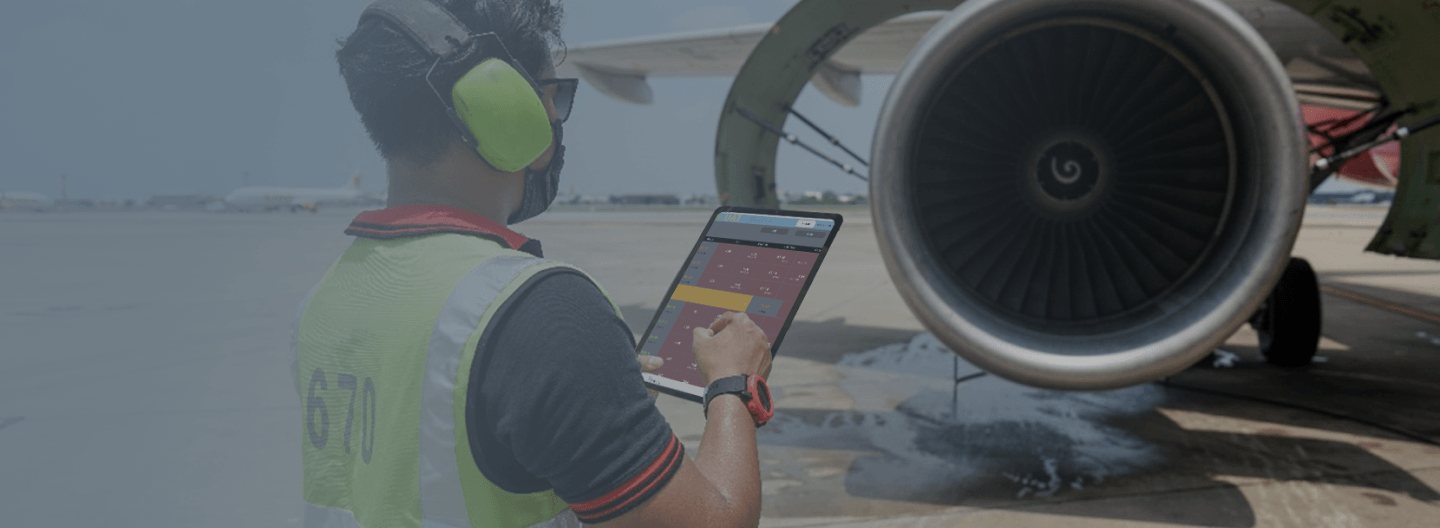 Employee on a tablet working on a plane